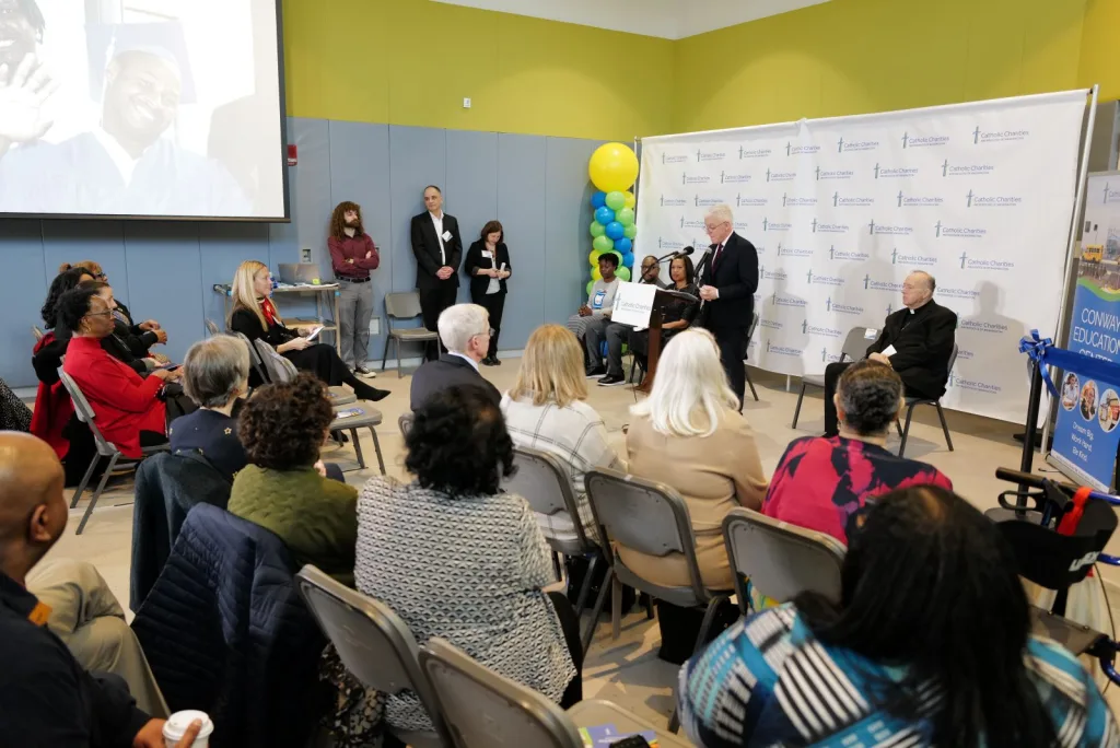Jim Malloy providing remarks in front of an audience of people at the Conway Education Center Dedication.
